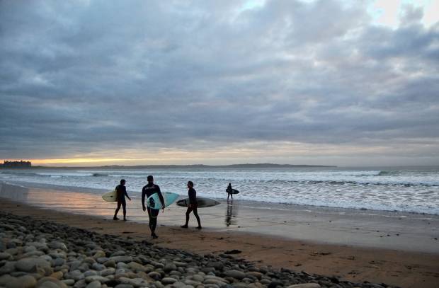 Doonbeg beach surfers