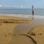 Stream issuing onto the beach, Swanage Bay