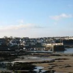 View across the sands towards Cemaes Harbour