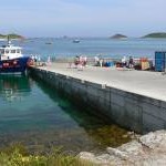 Boat arriving at Higher Town Quay, St Martins