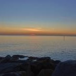 West Bay: Breakwater rocks at sunset