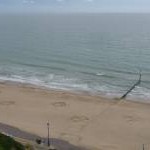 Bournemouth: view of beach from East Cliff, with lion’s pawprints