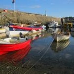 Colourful boats in Cemaes Harbour