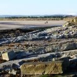 Rocks and sand southeast of Seahouses