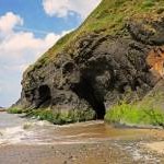 Headland with cave: Penbryn Beach