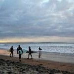Doonbeg beach surfers