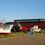 Local fishing boats are stored near the lifeboat station