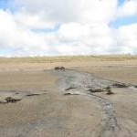 Drainage discharge from RAF Valley at Traeth Cymyran at low tide