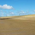 The dune line on the landward edge of Traeth Cymyran